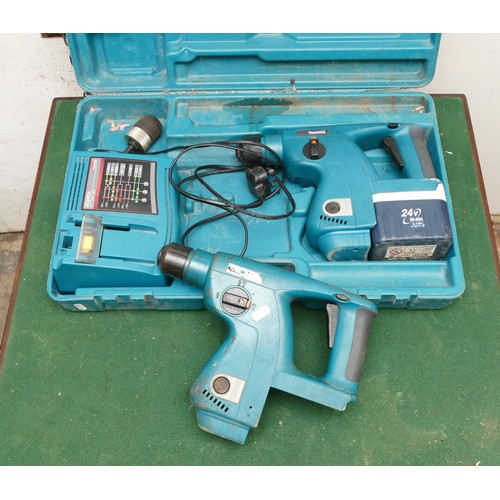 26 - A Makita 24mm Percussion Drill Breaker, boxed with a charger and a battery. Also includes spare dril... 