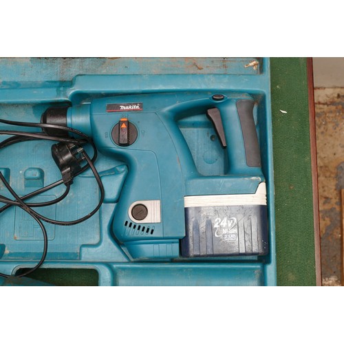 26 - A Makita 24mm Percussion Drill Breaker, boxed with a charger and a battery. Also includes spare dril... 