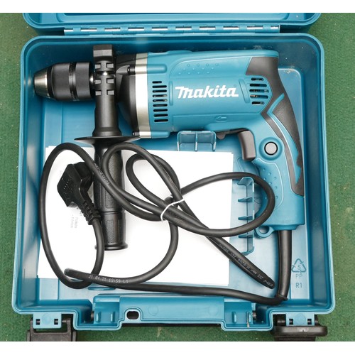 27 - A boxed Makita 240v hammer drill, model HP1631, appears to be unused.