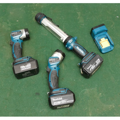 29 - A collection of four Makita torches/work lights, all with batteries. No charger.