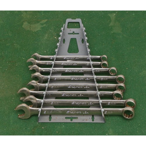 39 - A collection of Snap On metric ring spanners, sizes from 12-19mm. (8 spanners and a storage stand)