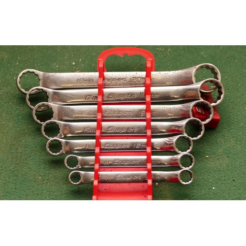 40 - A collection of Snap On metric ring spanners, sizes from 8-20mm. (7 spanners and a storage stand).