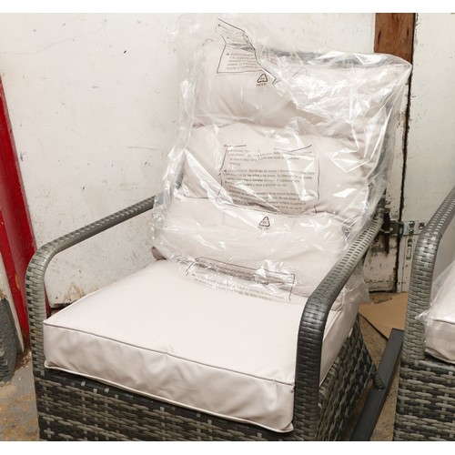 95 - A pair of modern garden rocker chairs, with detachable cushion seats, unused as new condition. (2)