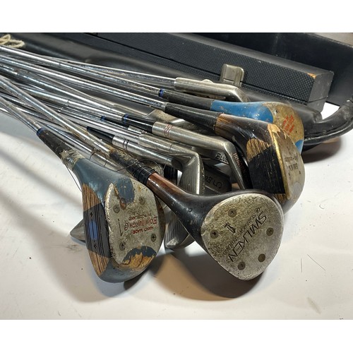 99 - A collection of golf clubs and woods to include Chevron, two sets of darts and three snooker cues, t... 