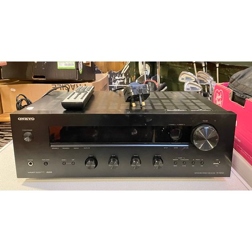 An Onkyo TX-8050 amplifier/receiver with remote.