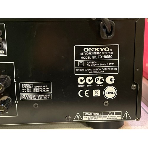 An Onkyo TX-8050 amplifier/receiver with remote.