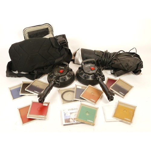 157 - A collection of camera accessories together with two cameras and two lenses, housed in two fabric sa... 