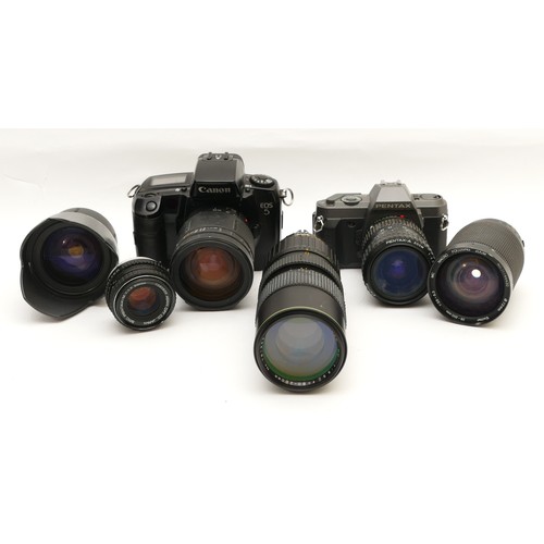 157 - A collection of camera accessories together with two cameras and two lenses, housed in two fabric sa... 