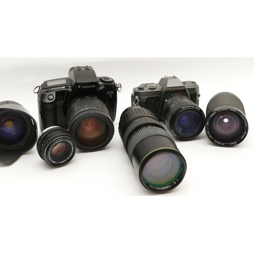 157 - A collection of camera accessories together with two cameras and two lenses, housed in two fabric sa... 