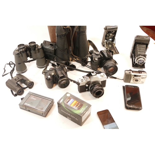 164 - A collection of cameras and binoculars, to include, a Praktica MTL3 film camera, a Fujifilm Finepix ... 