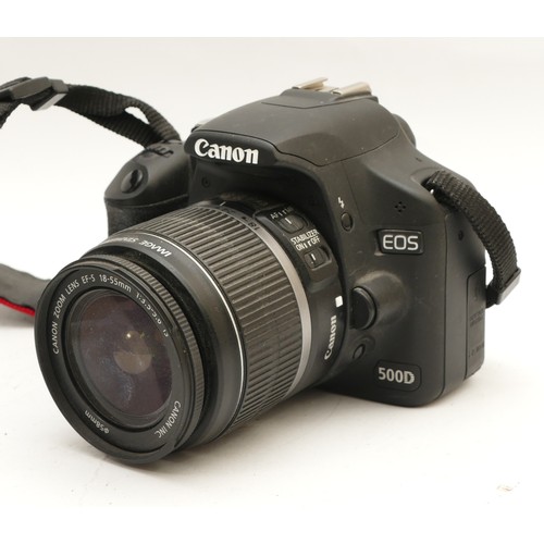 186 - A Canon EOS 500D camera with a Canon EF-S f/3.5-5.6 18-55mm lens.