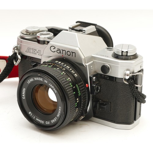 199 - A Canon AE-1 film camera with a Canon f/1.8 50mm lens.