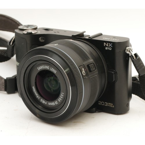 205 - A Samsung NX210 mirrorless compact camera.