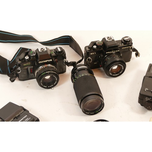 242 - A Praktica BC1 35mm camera, having additional lenses, flash light, and carry case, together with an ... 