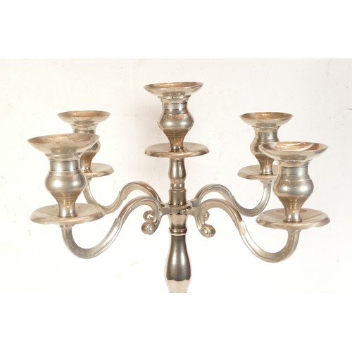 257 - A large modern four branch nickel plated candelabra, 69cm tall.