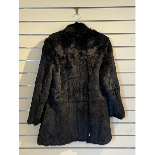 265 - Fur jacket by Faulkes of Edgbaston, Birmingham, 110cm chest, 102cm length. A black coney fur jacket,... 