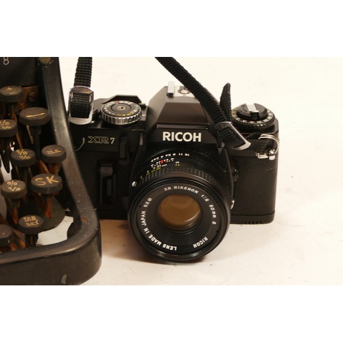 269 - An Olympia Mod 8 manual typewriter, together with a Ricoh XR7 SLR camera with a Rikenon f/2 50mm len... 