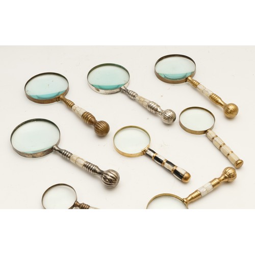 272 - Eight magnifying glasses, to include, examples with Mother of Pearl handles and brass or chrome band... 