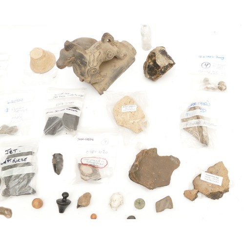 342 - A collection of East Yorkshire archaeological finds, to include a Roman bronze mask 5.5cm, bronze ag... 