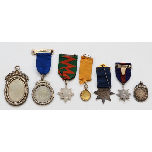 358 - A Fling Championship medal, 1935, Birmingham 1905, with thistle border, and six other medals/fobs, 1... 