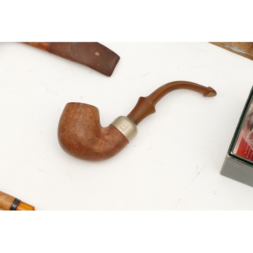 383 - Sixteen pipes, to include, a carved briar pipe depicting a bull, a French 'Colette' briar pipe, and ... 