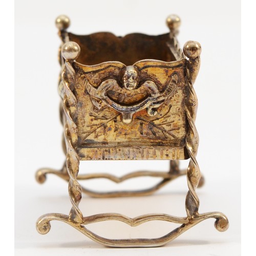 403 - An unmarked silver gilt cradle, with applied swag decorations, 4.5 x 4 x 4.5cm, 42gm