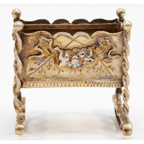 403 - An unmarked silver gilt cradle, with applied swag decorations, 4.5 x 4 x 4.5cm, 42gm