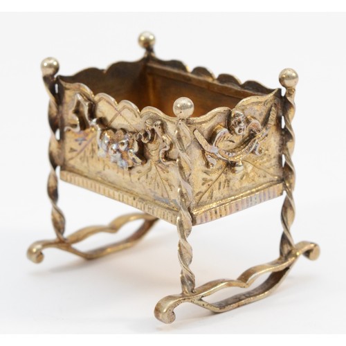 403 - An unmarked silver gilt cradle, with applied swag decorations, 4.5 x 4 x 4.5cm, 42gm