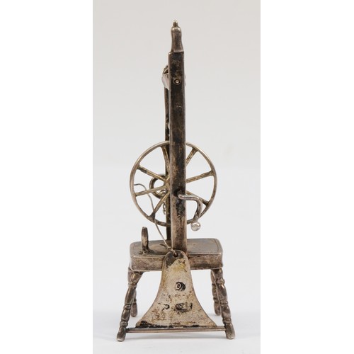 404 - A German novelty spinning wheel, Hanau marks, c.1900, 9.5cm, 36gm