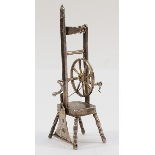 404 - A German novelty spinning wheel, Hanau marks, c.1900, 9.5cm, 36gm