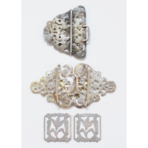 410 - A cast silver nurses buckle, London 1977, together with a cast silver half buckle, Chester 1899 and ... 