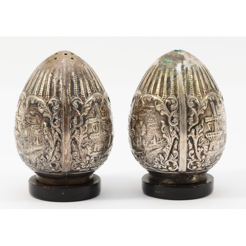 417 - A pair of Dutch egg shaped salt and pepper pots, embossed with Dutch scenery, marked HH 90, 6cm, 78g... 