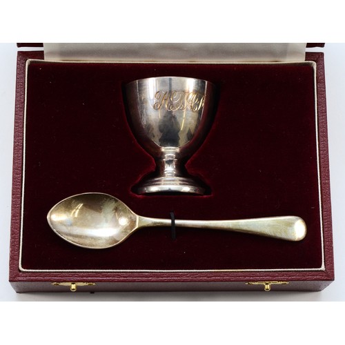 438 - An Asprey egg cup and spoon Christening set, Sheffield 1996, egg cup engraved 'HTAF', cased, 63gm.