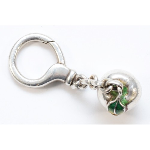 443 - Tiffany & Co, a 925 Italian silver Tiffany & Co Apple shaped key ring, with enamel leaf detail, 30gm... 