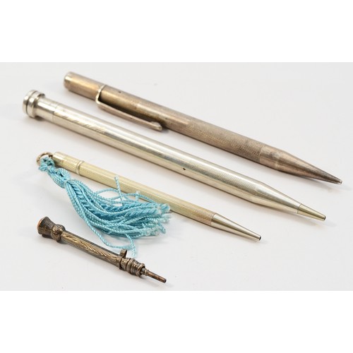 469 - Two silver propelling pencils together with two sterling silver examples, various sizes, largest mea... 