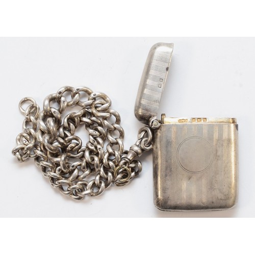 477 - A silver vesta case, Birmingham 1917, 5x4cm, with attached chain, 36cm, 70gm.