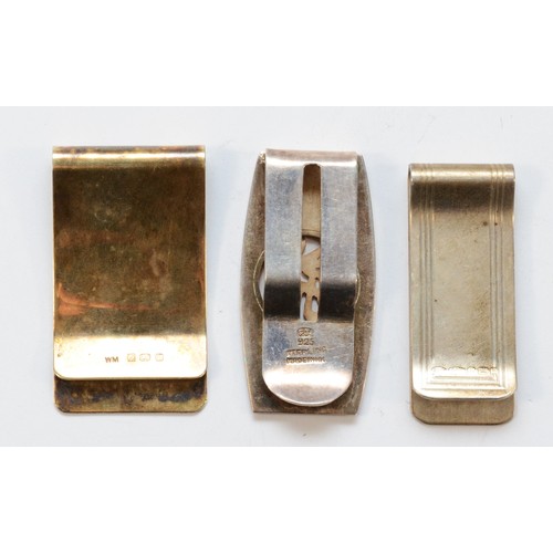 479 - A silver gilt money clip, Birmingham 1984, engraved A.J.W, together with two 925 silver money clips,... 