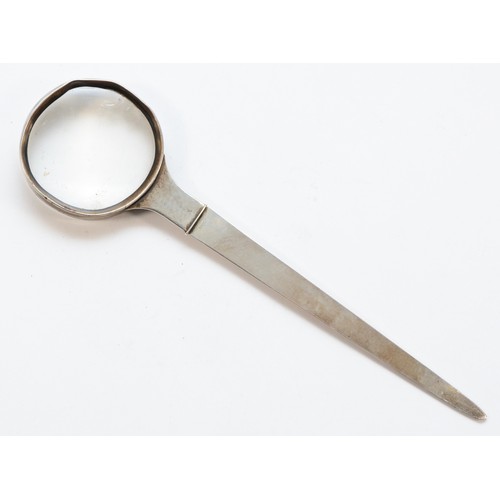 484 - A Tiffany & Co sterling silver letter opener, topped with a magnifying glass, having a slight chip t... 