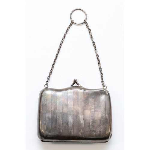 531 - A silver purse with 'E' engraved to the front, Birmingham 1911, with fitted interior, 9cm, 66gm.