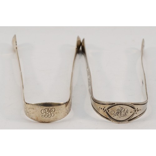 538 - A George III silver bright cut pair of sugar tongs, London 1807 and a later pair, 74gm