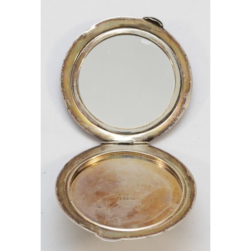 557 - A silver and guilloche enamel circular compact, Birmingham 1936, mirror but no powder, diameter 8cm,... 