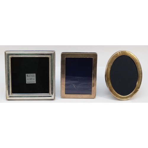 561 - A silver oval photograph frame, Sheffield 1987, 17x13cm, together with a 925 square frame, 16.5x16.5... 