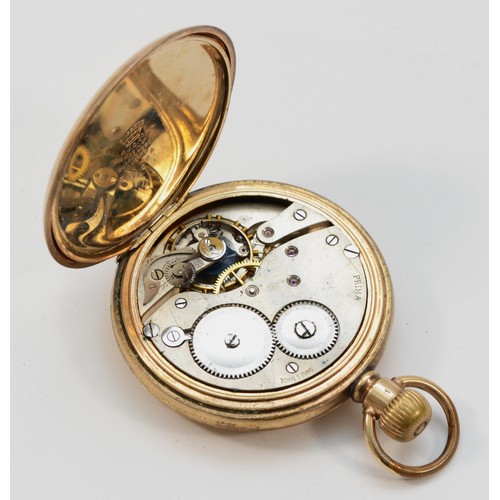 603 - Prima, a gold plated keyless wind hunter pocket watch.
Working when catalogued, case worn