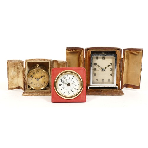 694 - Two 1930s travel alarm clocks, in original leather cases, one case stamped Harrods, with Swiss and F... 