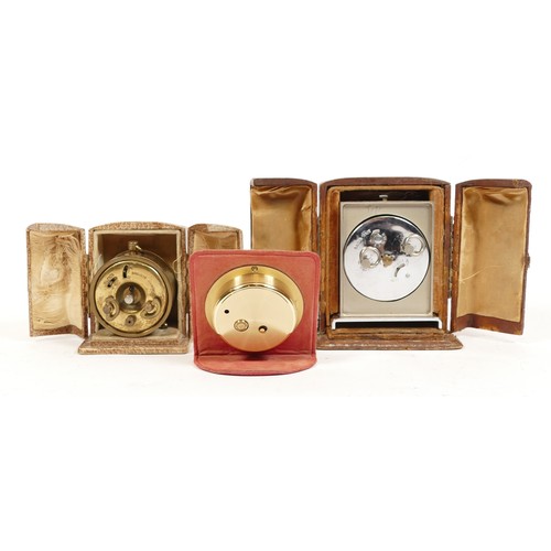 694 - Two 1930s travel alarm clocks, in original leather cases, one case stamped Harrods, with Swiss and F... 