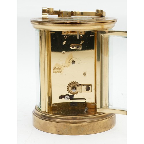 698 - A mid to late twentieth century Mistas brass carriage clock, in the form of a cylinder, having an en... 