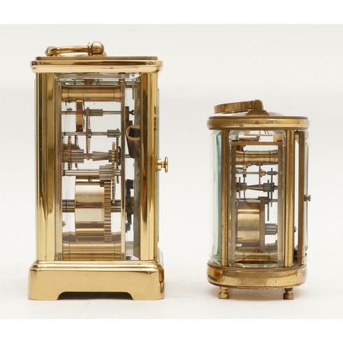 699 - Two mid to late twentieth century brass carriage clocks, housing 8 day movements, JW Benson, in the ... 