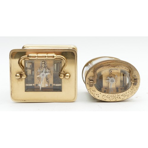 699 - Two mid to late twentieth century brass carriage clocks, housing 8 day movements, JW Benson, in the ... 