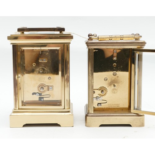 700 - Two mid to late twentieth century brass carriage clocks, having enamelled dials featuring both Roman... 