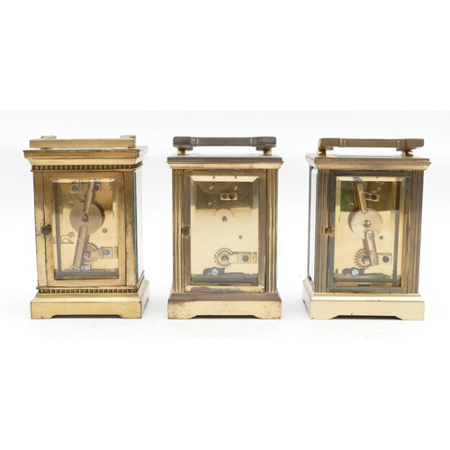 702 - Three mid to late twentieth century brass carriage clocks, having enamelled dials and featuring Roma... 